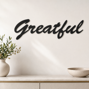Grateful cursive MDF wall art in matte black finish on a modern interior wall