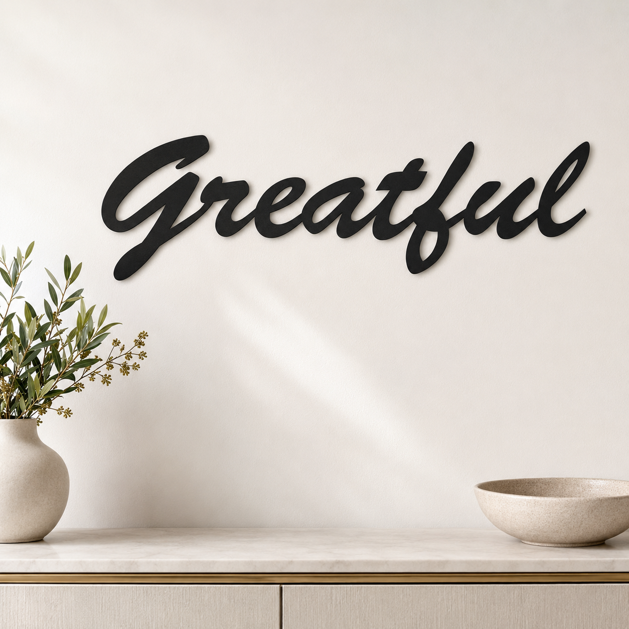 Grateful cursive MDF wall art in matte black finish on a modern interior wall