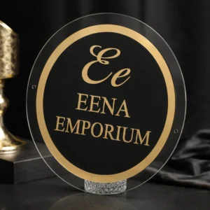 Custom round acrylic business name board in black and gold, studio hero view