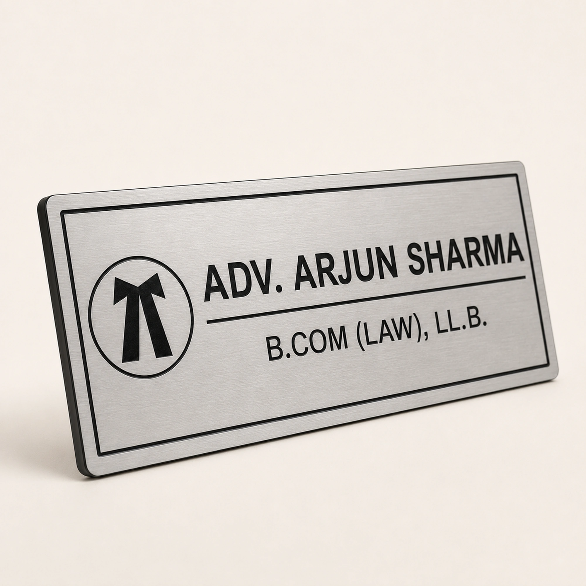 45-degree view of personalised brushed silver advocate name plate with acrylic base