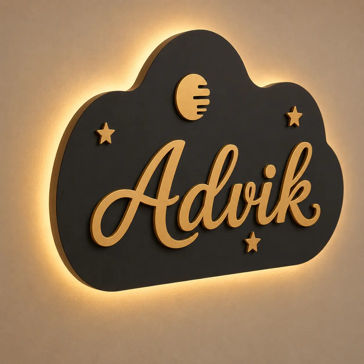 45-degree view of personalised kids room cloud name board showing matte black MDF, raised gold letters and LED halo
