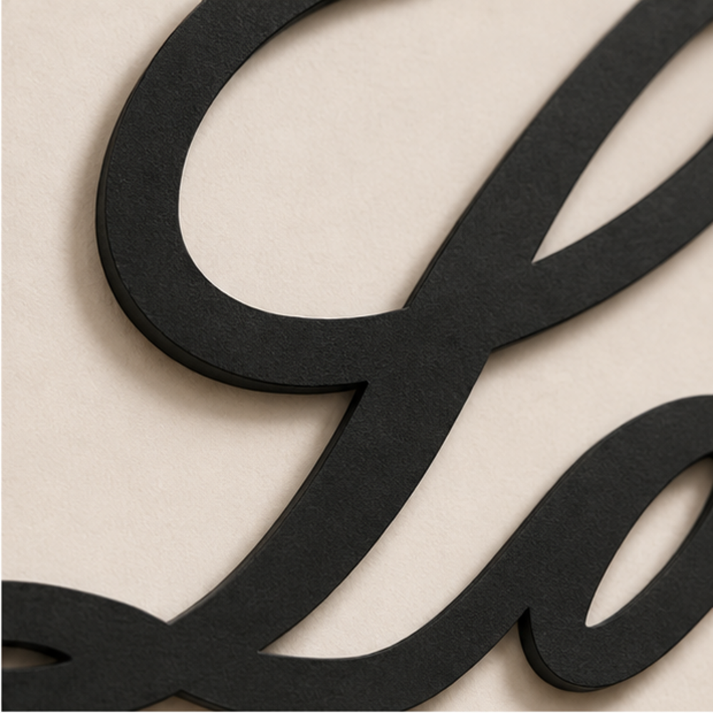 Close-up of Love Script MDF wall art showing precise laser-cut details