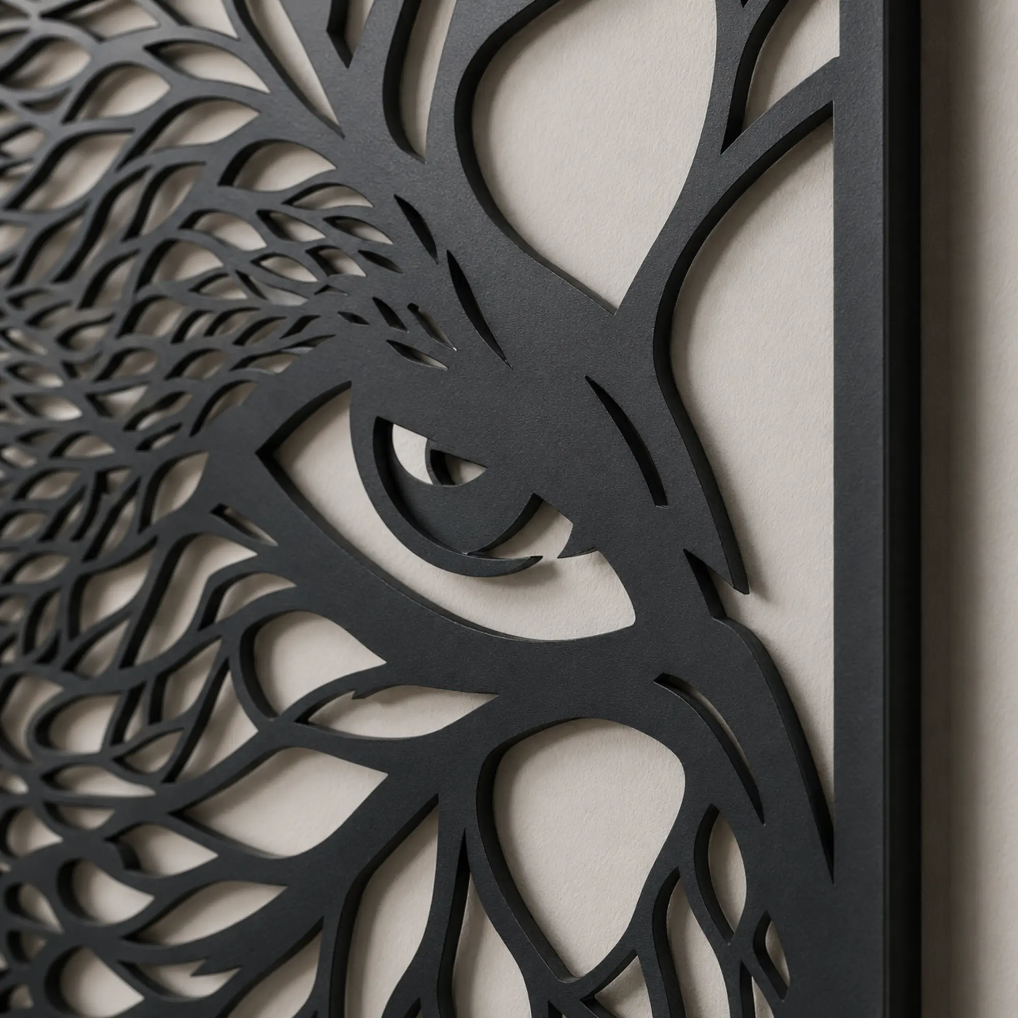 Close-up of intricate owl MDF wall art with black-and-white eye and feather details