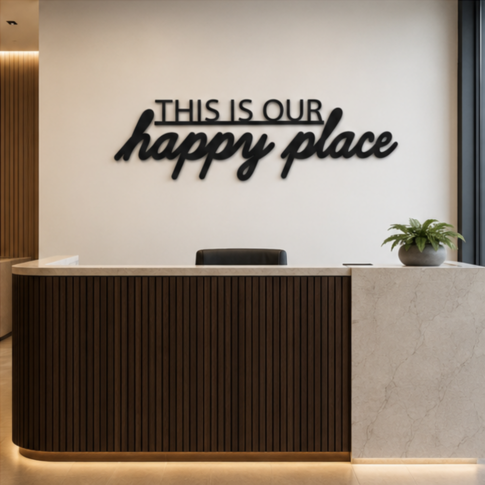 This Is Our Happy Place MDF wall art displayed in a modern reception