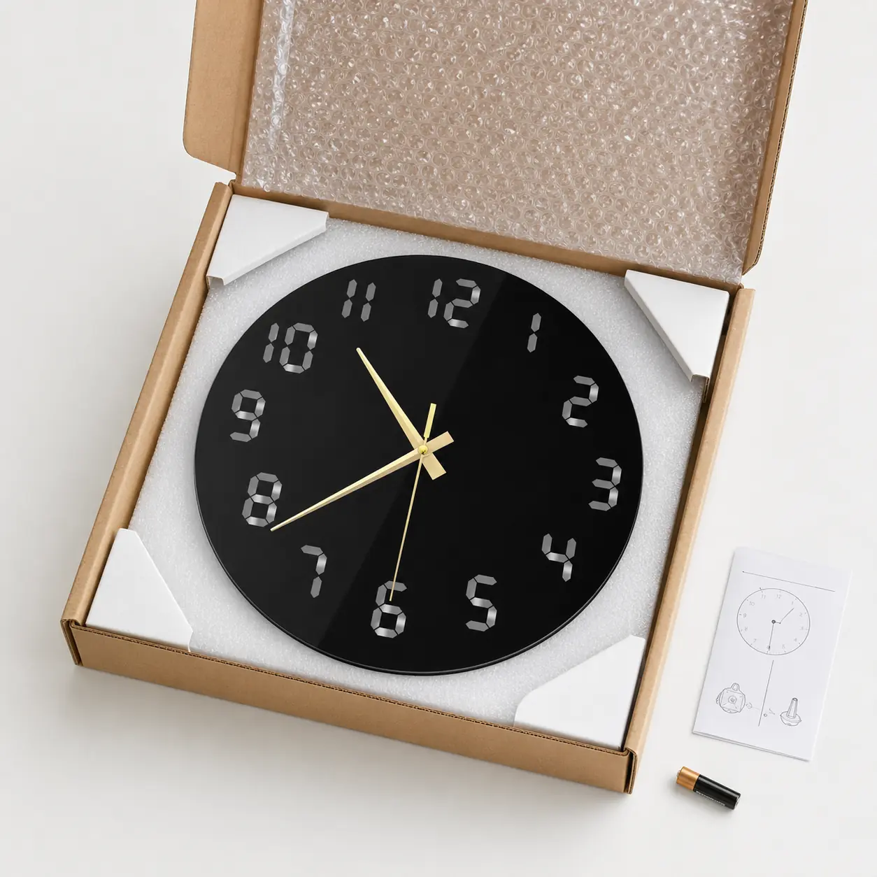 Glossy black acrylic wall clock protected with foam and bubble wrap for secure delivery