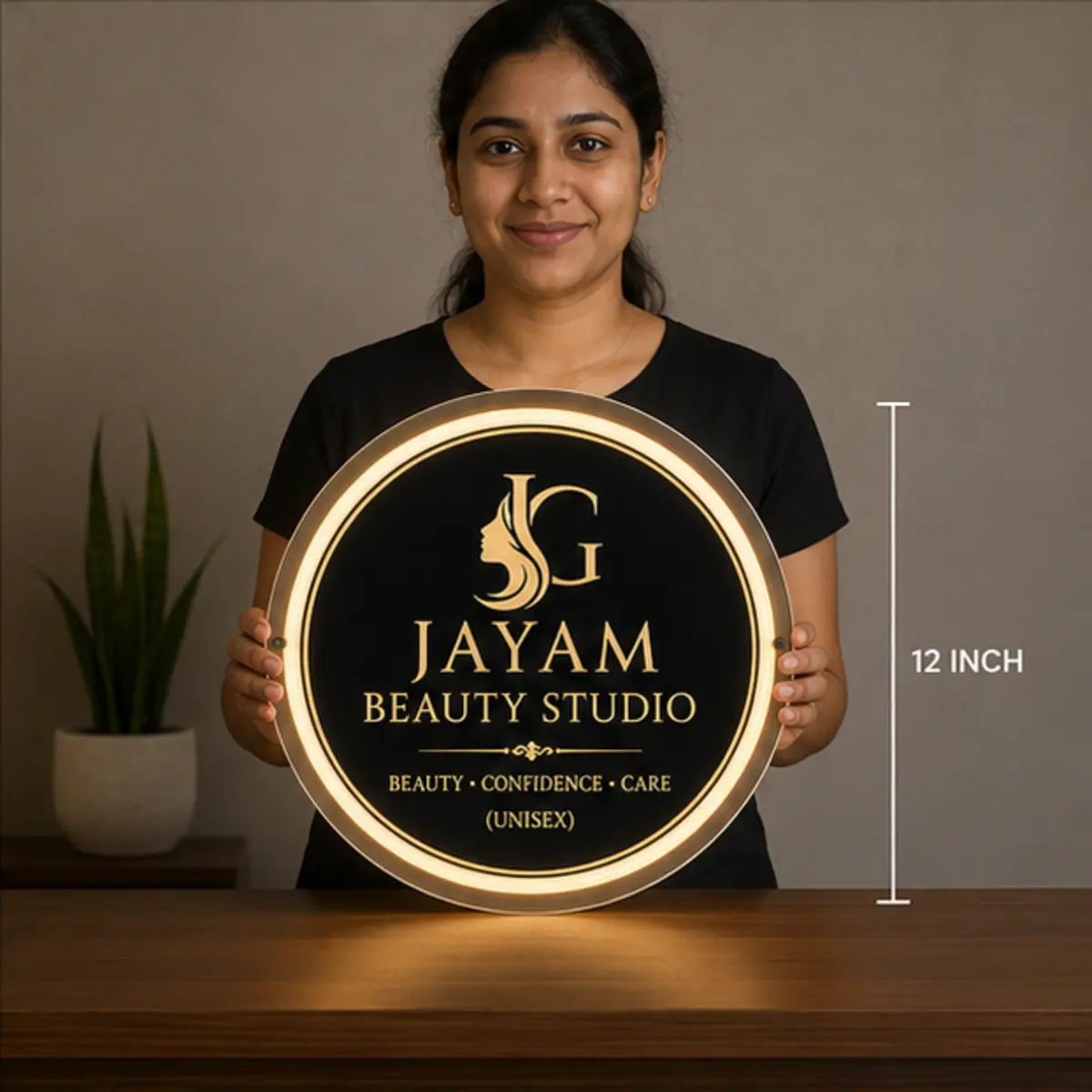 Twelve inch round acrylic LED light box sign held for real-world scale reference