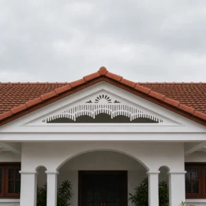 Arched Sunrise Multi-Band white PVC gable jaali hero on low-pitch Kerala roof