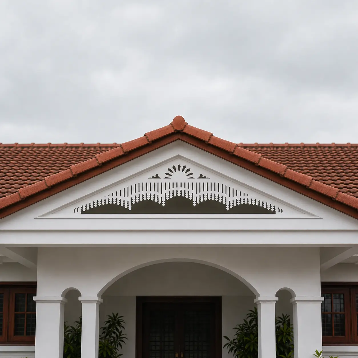 Arched Sunrise Multi-Band white PVC gable jaali hero on low-pitch Kerala roof