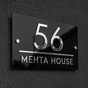 Glossy black and shiny silver acrylic house number plate showing 56 and Mehta House