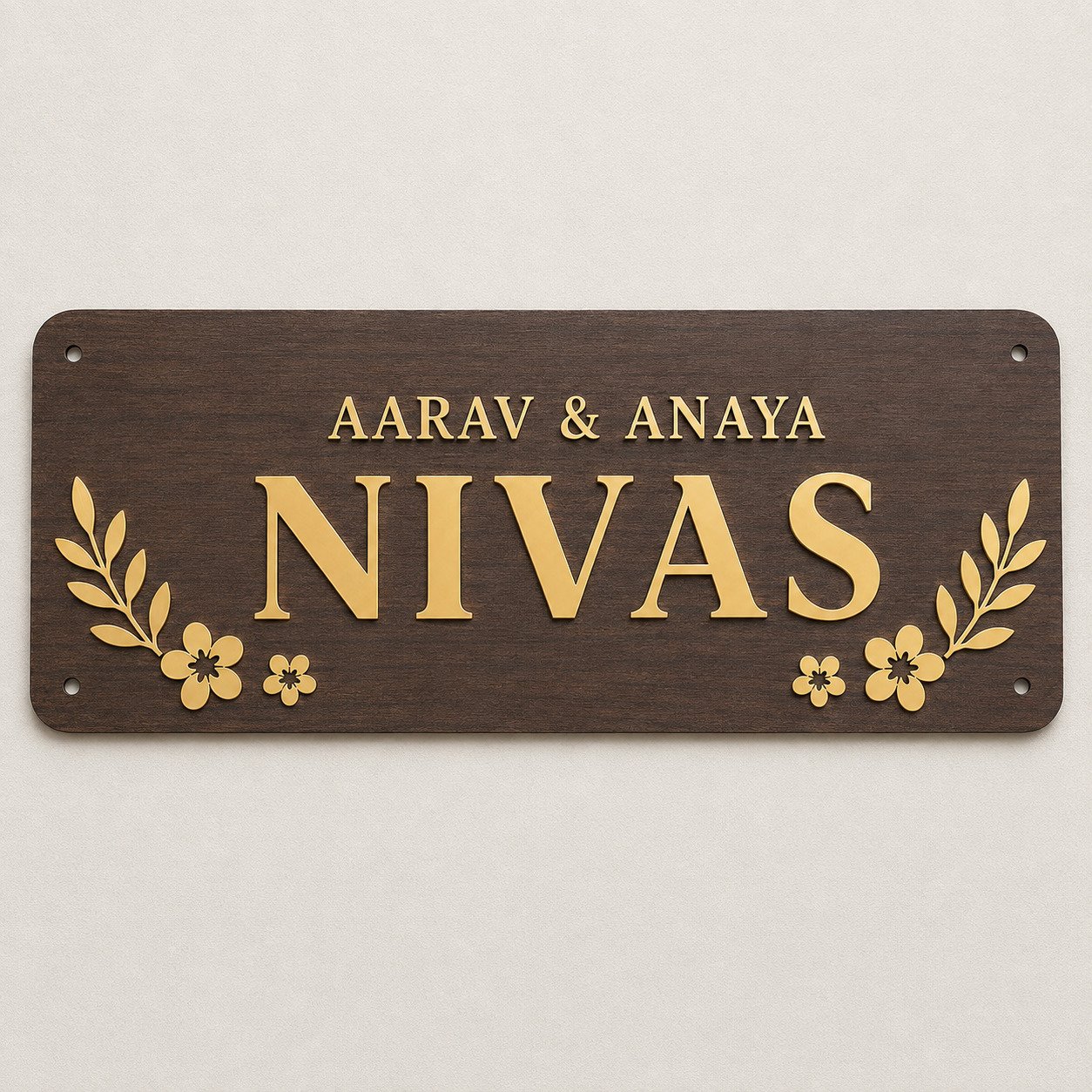 Front view of a walnut finish ACP name plate with gold mirror family name and decorative elements