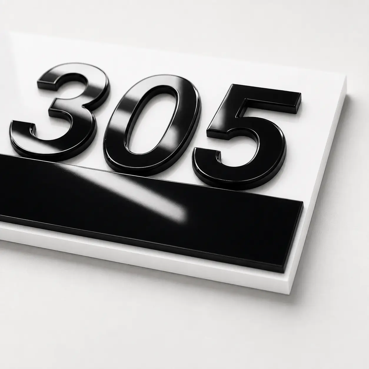 Close-up of 3 mm white base and raised 3 mm glossy black acrylic number 305
