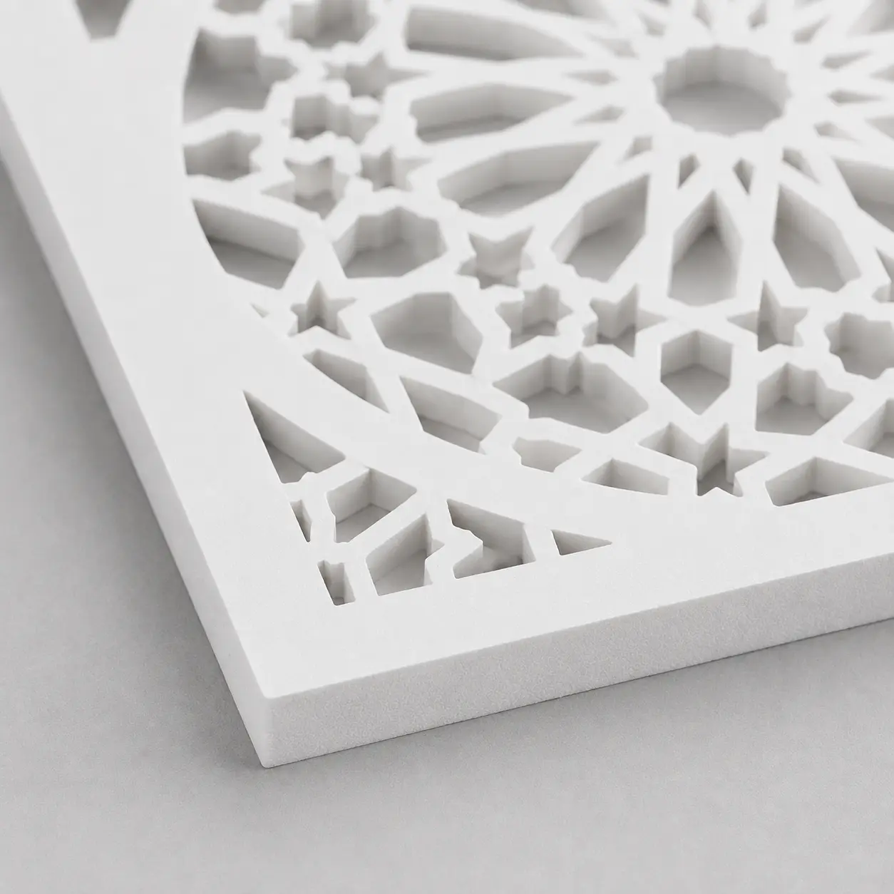 Close-up of Elongated Diamond Lattice CNC-cut pattern in white PVC foam board