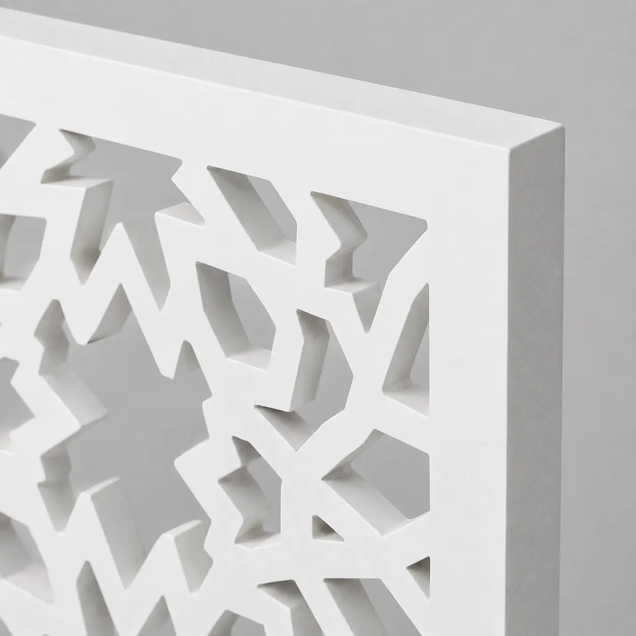 Close-up of Bold Eight-Point Floral CNC-cut pattern in white PVC foam board