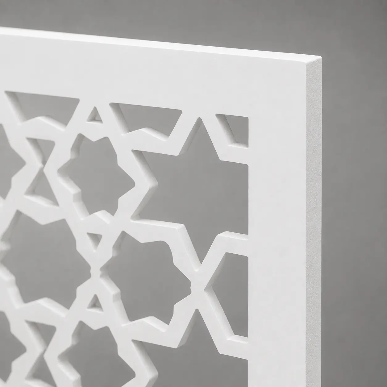 Close-up of Hexagon Star Lattice CNC-cut pattern in white PVC foam board