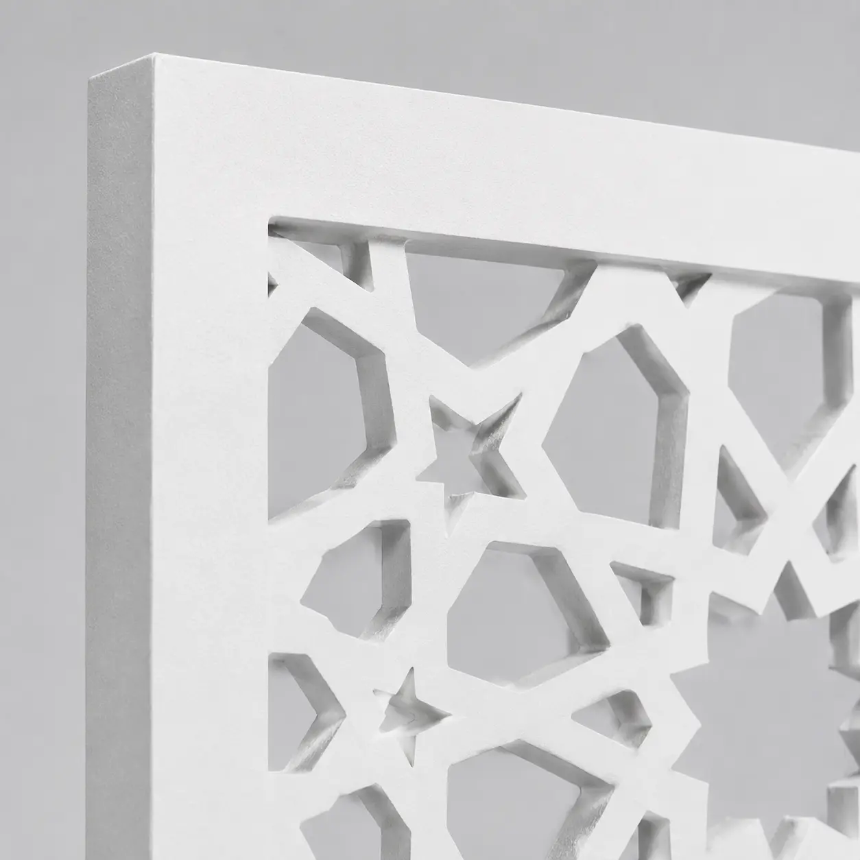 Close-up of Grand Starburst Mosaic CNC-cut pattern in white PVC foam board