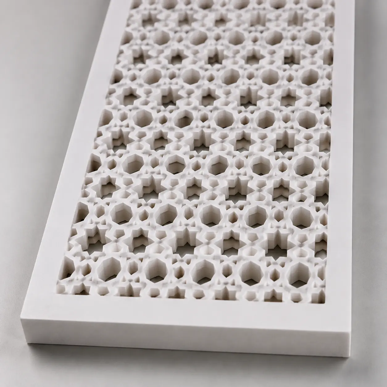 Close-up of Arabic Star Lattice CNC-cut pattern in white PVC foam board