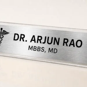 Custom brushed silver desk name plate with clear acrylic stand, doctor symbol and personalised name