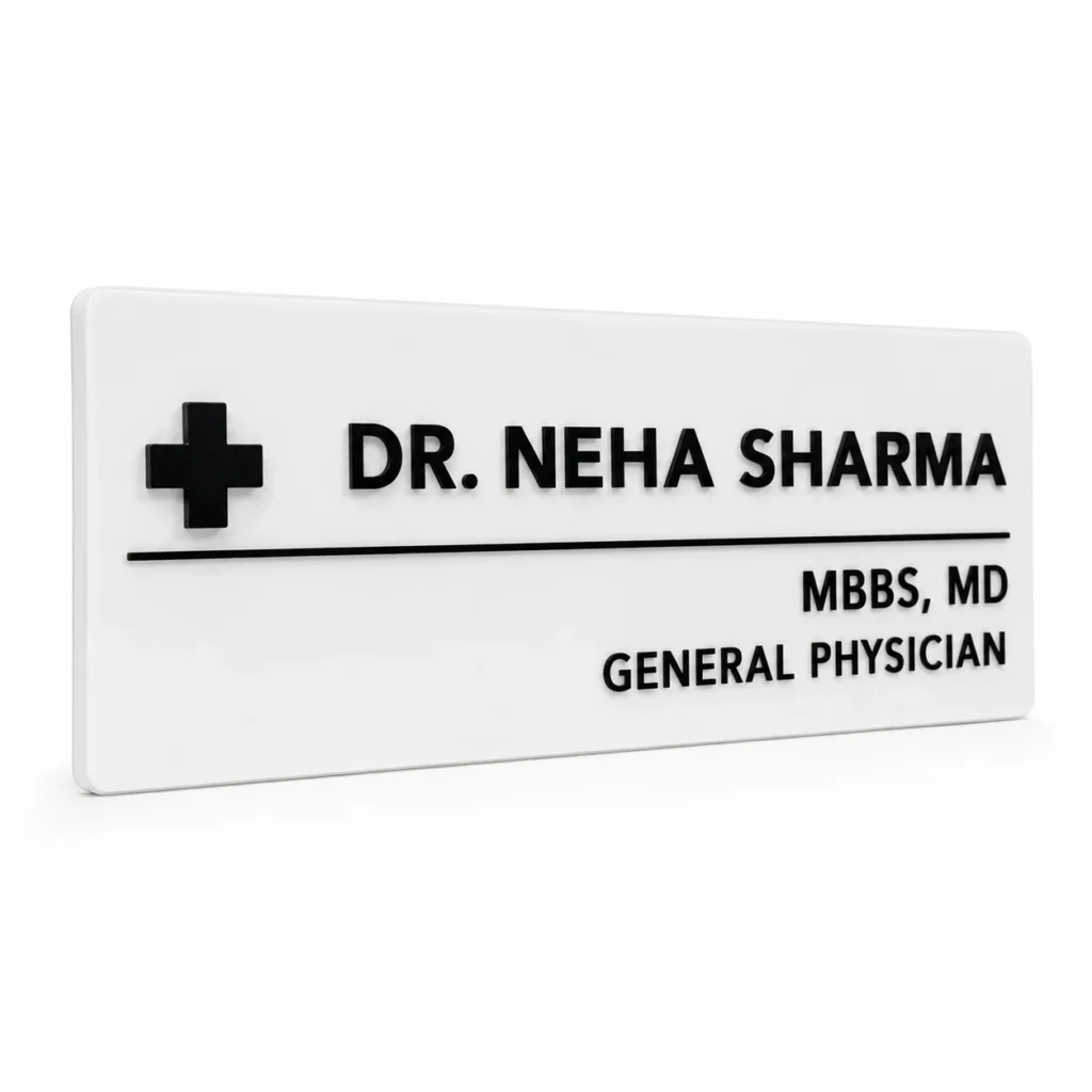Custom doctor name plate for clinic with white acrylic backing, black lettering and medical symbol
