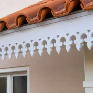Close-up of T-2 Fleur Pendant Lace CNC PVC Roof Border showing white PVC foam board and sharp CNC-cut edges